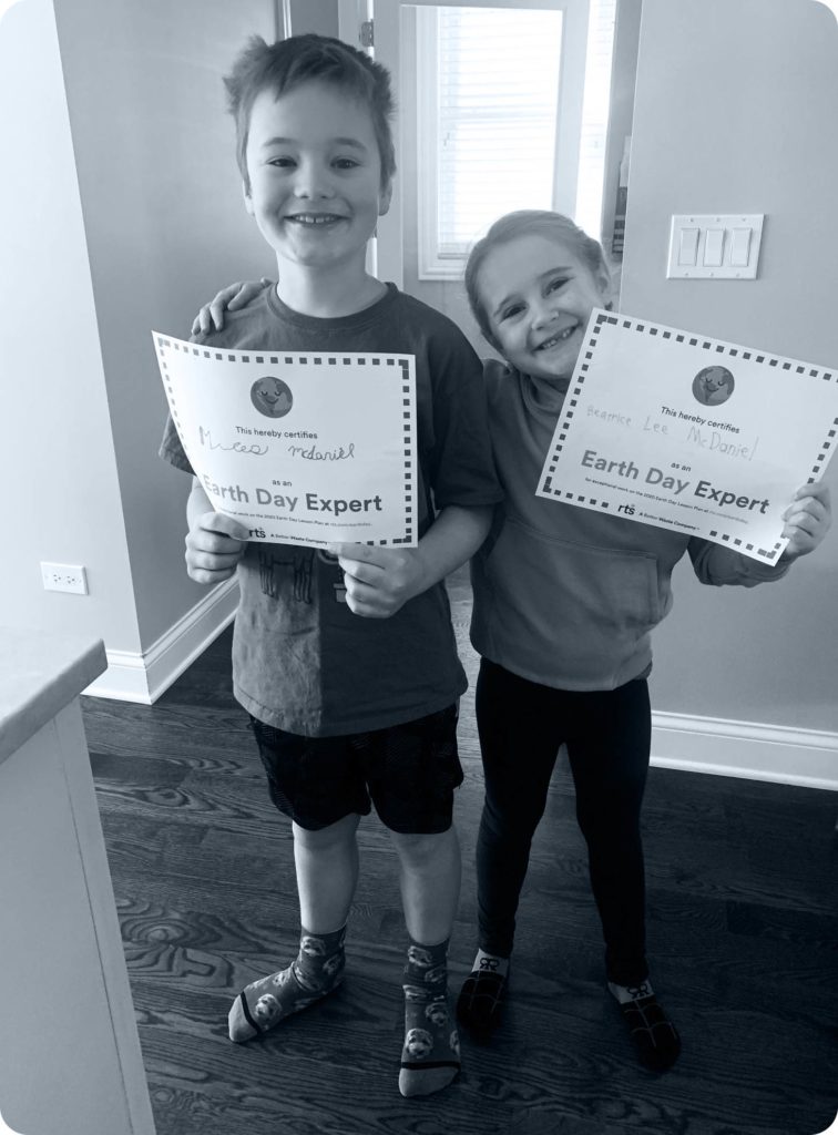 two children with zero waste education certificates