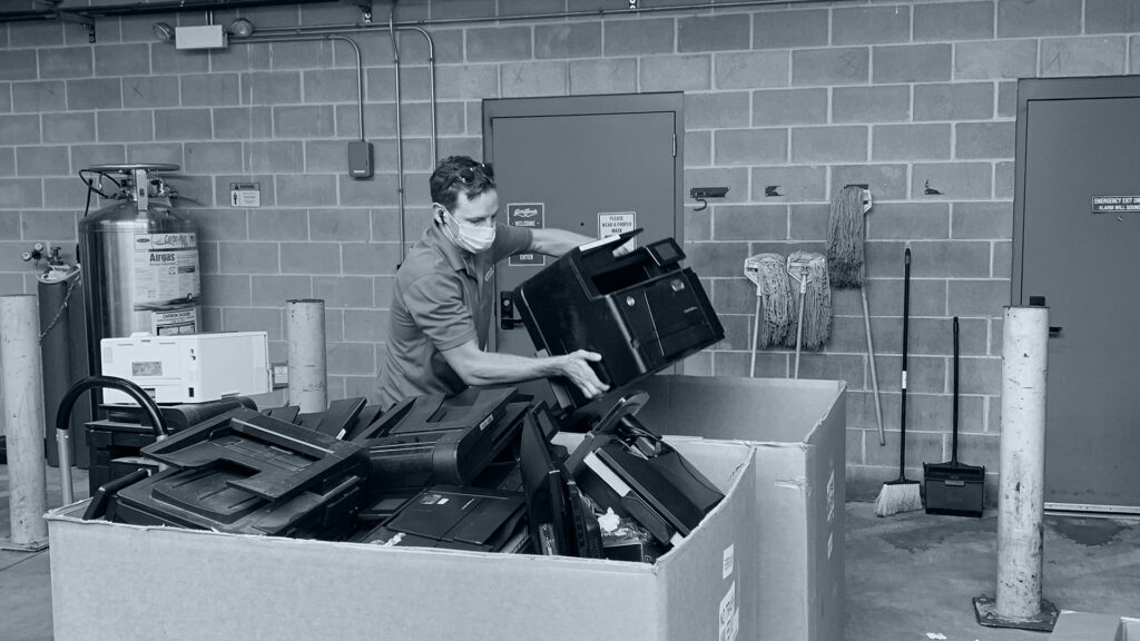 image of man recycling electronic waste
